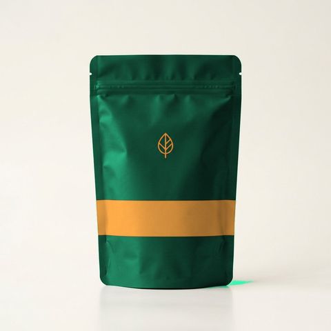 Forest-green Annasati pouch with an ochre band, packaging concept